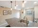 Modern kitchen with granite countertop, stainless steel appliances, and island with seating at 175 116Th Ave # 102, Treasure Island, FL 33706