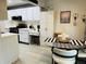 Bright kitchen with white cabinets and black appliances at 5980 80Th N St # 210, St Petersburg, FL 33709