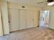 Bedroom with sliding door closet and access to another room at 2070 World Parkway Blvd # 36, Clearwater, FL 33763