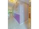 Clean hallway with light purple walls and tile floor at 1111 N Bayshore Blvd # C7, Clearwater, FL 33759