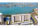 Aerial view of a high rise building near the water at 7050 Sunset S Dr # 203, South Pasadena, FL 33707