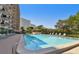 Inviting community pool with lounge chairs at 7050 Sunset S Dr # 203, South Pasadena, FL 33707