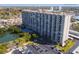 High-rise building with pool and parking at 7050 Sunset S Dr # 203, South Pasadena, FL 33707