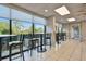 Bright community room with tables, chairs, and large windows at 7050 Sunset S Dr # 203, South Pasadena, FL 33707