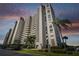 Exterior view of a tall residential building at 7050 Sunset S Dr # 203, South Pasadena, FL 33707