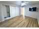 Bedroom with wood-look floors and a large closet at 2430 Brazilia Dr # 10, Clearwater, FL 33763