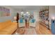 Inviting living room with cozy seating, open kitchen, and built-in bookshelves at 308 Mariner Dr # 308, Tarpon Springs, FL 34689
