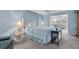 Spacious bedroom with light blue walls and comfortable bedding at 5130 Brittany S Dr # 106, St Petersburg, FL 33715
