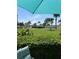 Relaxing view of waterfront property from under a beach umbrella at 5130 Brittany S Dr # 106, St Petersburg, FL 33715