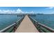 Long wooden dock extending over calm water, offering scenic waterfront views at 5130 Brittany S Dr # 106, St Petersburg, FL 33715