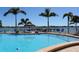 Inviting swimming pool with lounge chairs and waterfront views at 5130 Brittany S Dr # 106, St Petersburg, FL 33715
