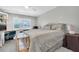 Comfortable bedroom with a built-in workspace and a queen-size bed at 5130 Brittany S Dr # 106, St Petersburg, FL 33715