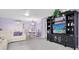 Open living space with sectional sofa and built-in entertainment center at 5130 Brittany S Dr # 106, St Petersburg, FL 33715