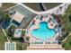 Relaxing community pool with plenty of lounge chairs at 5130 Brittany S Dr # 106, St Petersburg, FL 33715