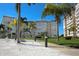 Building exterior with landscaping, palm trees and walkway at 5130 Brittany S Dr # 106, St Petersburg, FL 33715
