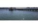 Serene waterfront view with a pier and calm waters at 5130 Brittany S Dr # 106, St Petersburg, FL 33715