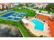 Community pool and tennis courts with water access at 308 Mariner Dr # 308, Tarpon Springs, FL 34689