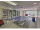 Community room with ping pong table and extensive book collection at 308 Mariner Dr # 308, Tarpon Springs, FL 34689