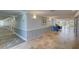 Building hallway with tile floors and seating area at 308 Mariner Dr # 308, Tarpon Springs, FL 34689