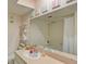 Bathroom with a bathtub, vanity, and large mirror at 308 Mariner Dr # 308, Tarpon Springs, FL 34689