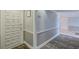 Building hallway with carpet and doors to units at 308 Mariner Dr # 308, Tarpon Springs, FL 34689