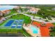Community pool, tennis, pickleball courts, and pond at 308 Mariner Dr # 308, Tarpon Springs, FL 34689