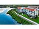 Luxury condo building with waterfront views and walkway at 308 Mariner Dr # 308, Tarpon Springs, FL 34689