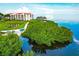 Waterfront community with lush landscaping and building at 308 Mariner Dr # 308, Tarpon Springs, FL 34689