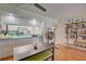 Bright dining area with hardwood floors and open kitchen view at 308 Mariner Dr # 308, Tarpon Springs, FL 34689