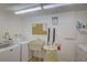Shared laundry room with coin-operated washer and dryer at 308 Mariner Dr # 308, Tarpon Springs, FL 34689