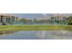 Community tennis courts situated by a pond at 308 Mariner Dr # 308, Tarpon Springs, FL 34689