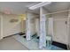 Clean community bathroom with multiple shower stalls at 308 Mariner Dr # 308, Tarpon Springs, FL 34689