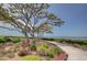 Landscaped grounds with a walking path and waterfront views at 308 Mariner Dr # 308, Tarpon Springs, FL 34689