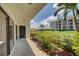 Private patio with view of the condo building and lawn at 308 Mariner Dr # 308, Tarpon Springs, FL 34689