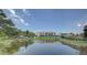 Waterfront property with pond and community building view at 308 Mariner Dr # 308, Tarpon Springs, FL 34689