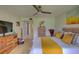 Main bedroom with hardwood floors and a king-size bed at 308 Mariner Dr # 308, Tarpon Springs, FL 34689