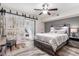 Main bedroom with barn door and gray platform bed at 4071 55Th N Way # 1051, Kenneth City, FL 33709