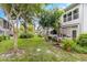 Relaxing backyard with lush landscaping and seating area at 4071 55Th N Way # 1051, Kenneth City, FL 33709