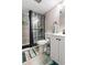 Updated bathroom features a tiled shower with glass enclosure, and a modern vanity at 4071 55Th N Way # 1051, Kenneth City, FL 33709