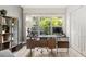 Home office features large windows overlooking a green space at 4071 55Th N Way # 1051, Kenneth City, FL 33709