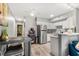 Open kitchen has modern appliances, wood floors and a small dining table at 4071 55Th N Way # 1051, Kenneth City, FL 33709