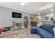 Comfortable living room with neutral paint, wood floors and a ceiling fan at 4071 55Th N Way # 1051, Kenneth City, FL 33709