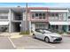 Front view of condo with parking and awning at 4071 55Th N Way # 1051, Kenneth City, FL 33709