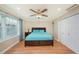 Bedroom with queen-size bed and wood floors at 3455 41St S Ter # 208, St Petersburg, FL 33711