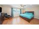 Main bedroom with king-size bed and wood floors at 3455 41St S Ter # 208, St Petersburg, FL 33711