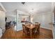 Dining room with hardwood floors, a wooden table, and a view of the living room at 3455 41St S Ter # 208, St Petersburg, FL 33711