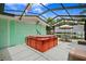 Relaxing hot tub in a screened patio area at 5244 40Th S St, St Petersburg, FL 33711