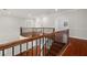 Open upper landing with hardwood floors and railing at 6016 82Nd N Ter, Pinellas Park, FL 33781