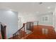 Spacious upper hallway with hardwood floors and window at 6016 82Nd N Ter, Pinellas Park, FL 33781
