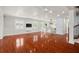Bright and airy living area with hardwood floors and open kitchen at 6016 82Nd N Ter, Pinellas Park, FL 33781